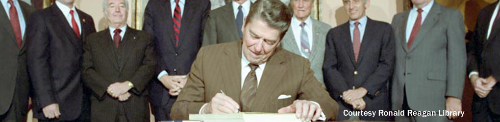 President Ronald Reagan signing Immigration law in 1986; Courtesy Ronald Reagan Library